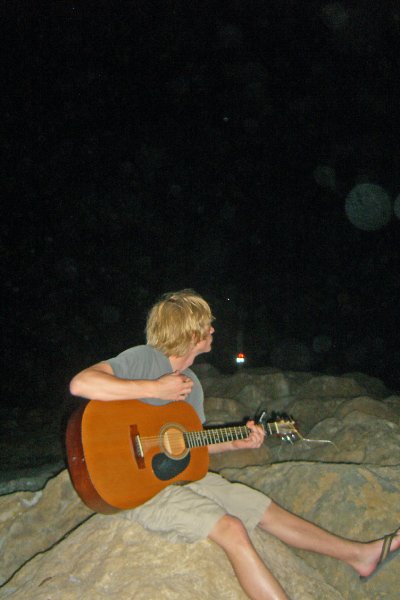 CIMG8325_edited-1.jpg - Mike on the beach at Redfish Pass, playing guitar
