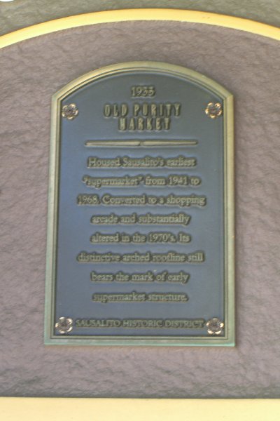 CIMG6549.JPG - 1935 Old Purity Market.Housed Sausalito's earliest "supermarket" from 1941 to 1968.  Converted to a shopping arcde and substantially altered in the 1970's, It's distinctive arched roofline still bears the mark of early supermarket structure.Sausalito Historic District