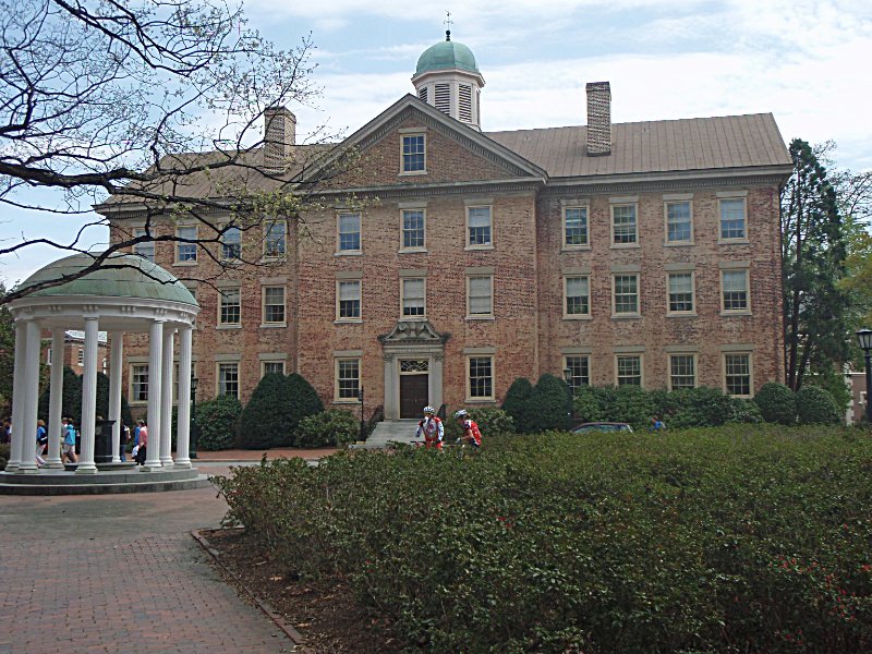 P4020119_edited-1.jpg - Old Well (left), South Building (Other side of Cameron Avenue) -- facing South, standing on McCorkle Place