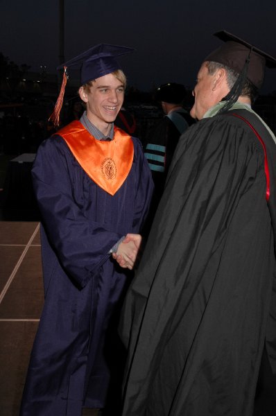 MikeCeremonyHandshakeOrig.jpg - Commencement Photos