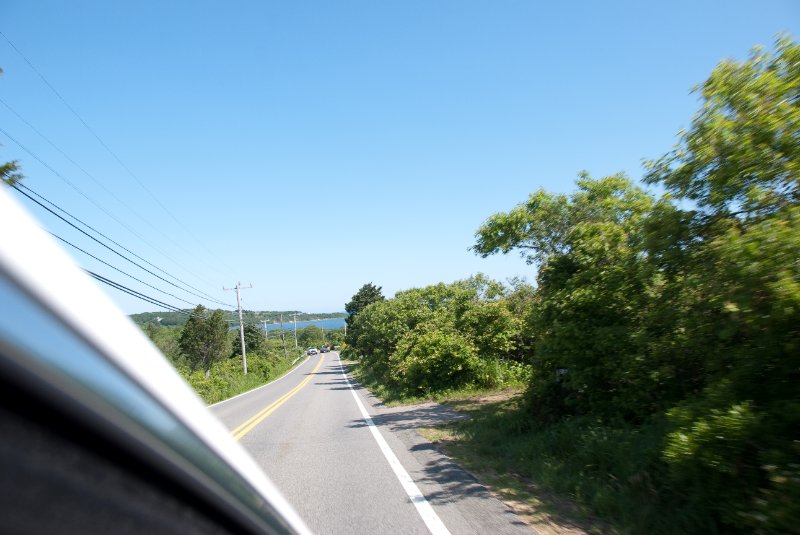 DSC_7704.jpg - Driving through Chilmark.  Menemsha Pond (distant background).