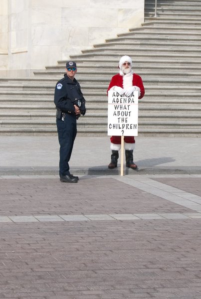 WashDC032709-4252-2.jpg - Santa protester at the stairs to the House of Representatives