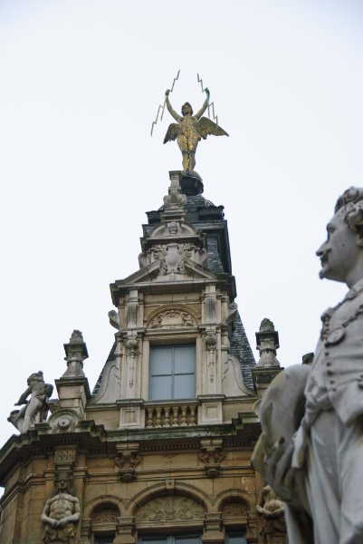 Antwerp021610-1344.jpg - Angelic figure at the top of the building at the intersection of Jezusstraat and Meir Streets. Antoon van Dyck, Meir Street.( (Foreground right edge)