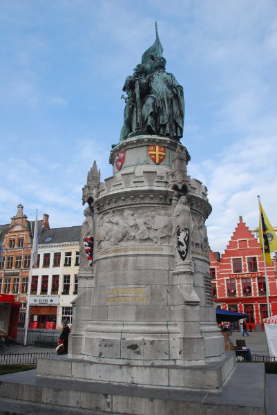 Bruge021710-1605.jpg - Statues of Jan Breydel and Pieter de Coninck in the center of the Markt square. The North side guild houses in the background.