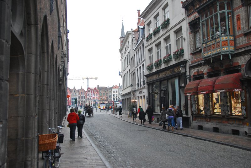 Bruge021710-1746.jpg - Walking North on Wollestraat.  Belfort on left side.