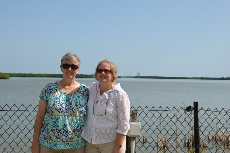 KSC110110-6514.jpg - Cathie and Marian with Discovery in the background, view from Apollo / Saturn V Center