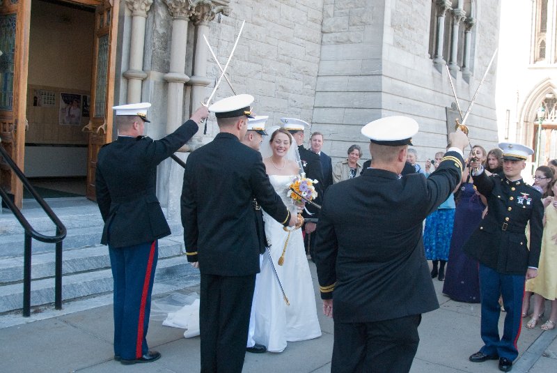 Syracuse041010-2212.jpg - Maureen and Tyson walking the traditional Sword Arch after their Wedding ceremony.  In front of the Cathedral of the Immaculate Conception.