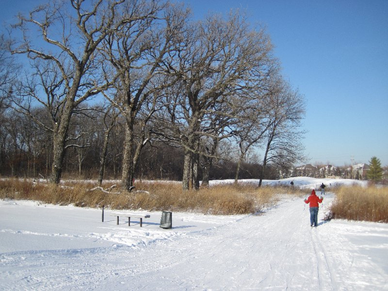 XCSkiArrowhead122910-2045.jpg - Watching Liz and Mike Cross Country Skiing Arrowhead West Golf Course at 8th tee.