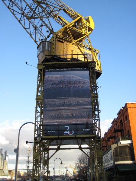 BuenosAires080210-1562.jpg - Poster on crane celebrates 20 year anniversary, port restoration.