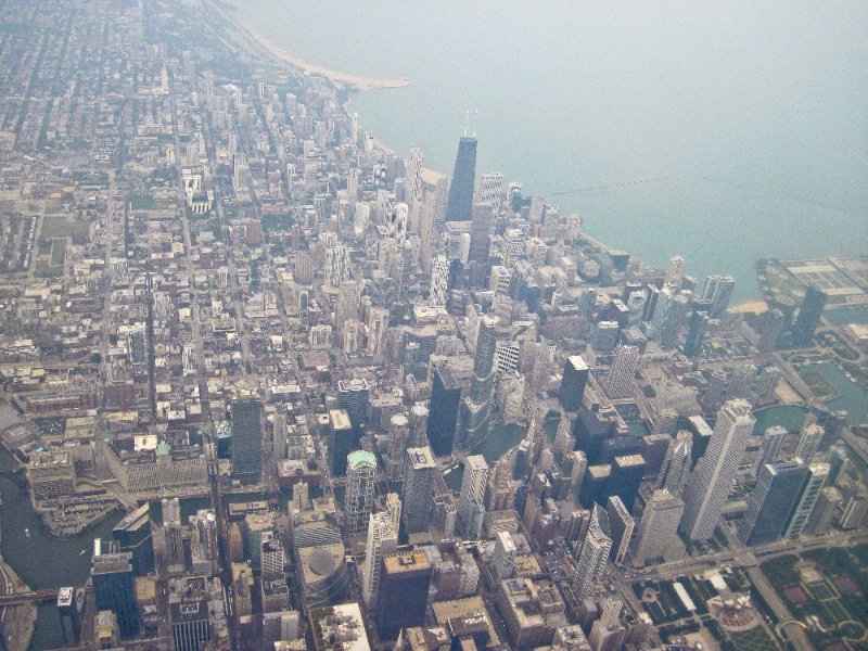 IMG_1963.jpg - Flying over downtown Chicago. Hancock Building (black tower, center)