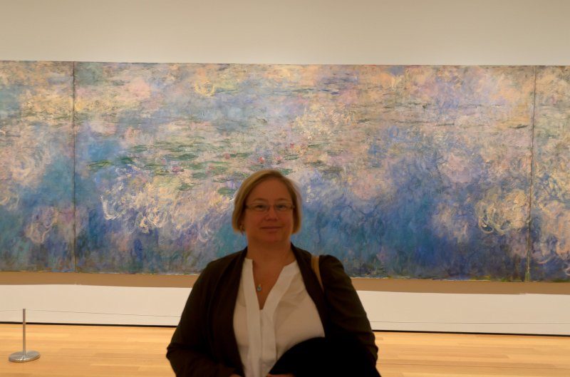 Manhattan032611-2019.jpg - Cathie infront of Monet's 3-panel Water Lilies painting