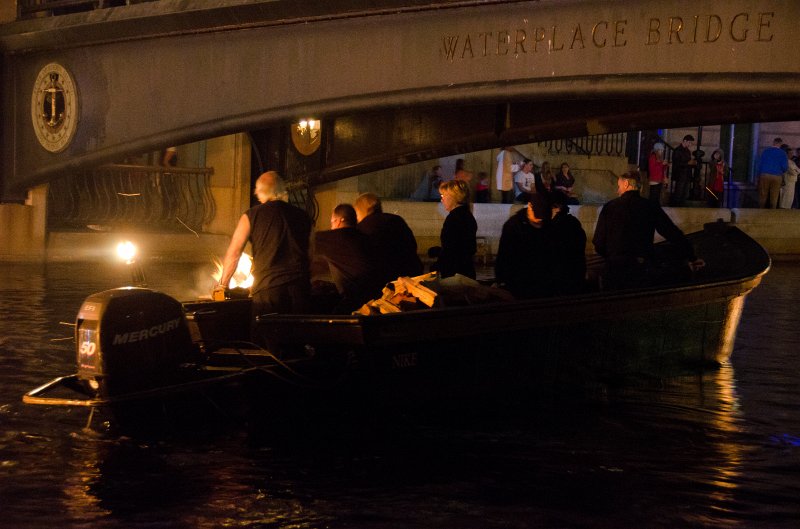 Providence060211-3520.jpg - Waterfire wood crew restocking a floating cauldron, Waterplace Bridge