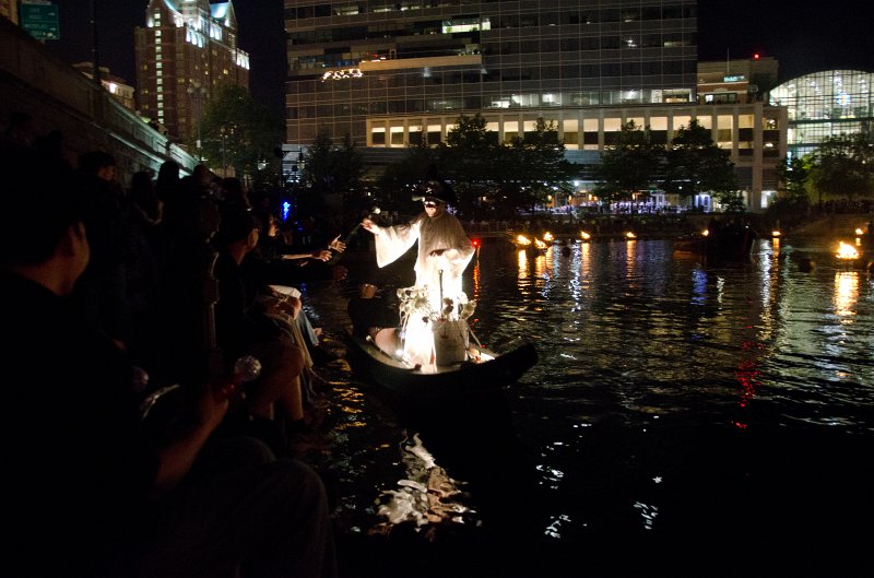 Providence060211-3531.jpg - Mime Michael Grando handing out flowers with quotations. GTech Center (background), viewed during Waterfire