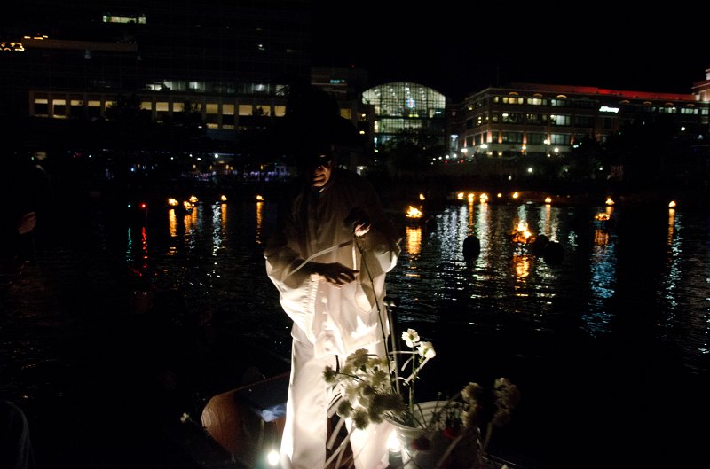 Providence060211-3533.jpg - Mime Michael Grando handing out flowers. Providence Place Mall (background), viewed during Waterfire