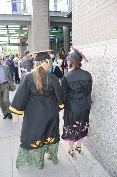 Providence060211-3656.jpg - Liz and Bin showing us there cap and gown designs