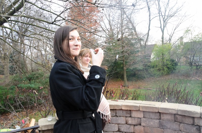 ThanksgivingNov2011-7317.jpg - Emily and Liz roasting marshmallows