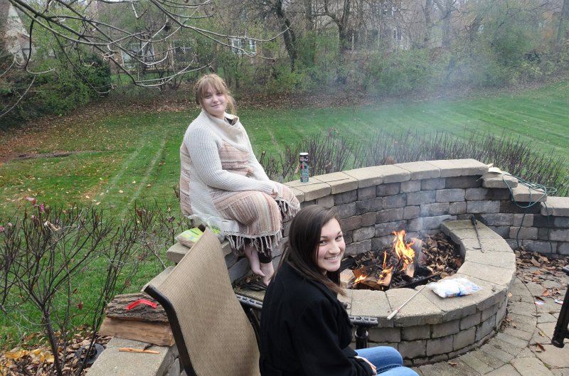 ThanksgivingNov2011-7326.jpg - Emily and Liz roasting marshmallows