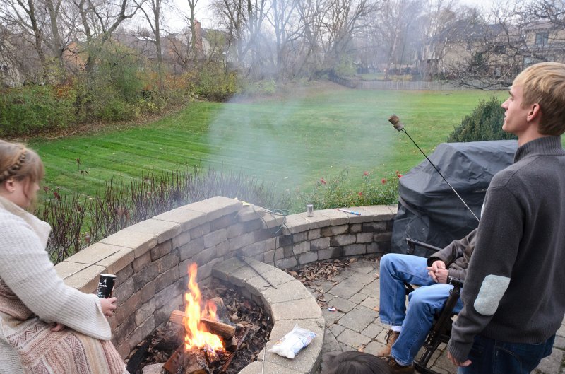 ThanksgivingNov2011-7340.jpg - Mike and Liz roasting marshmallows