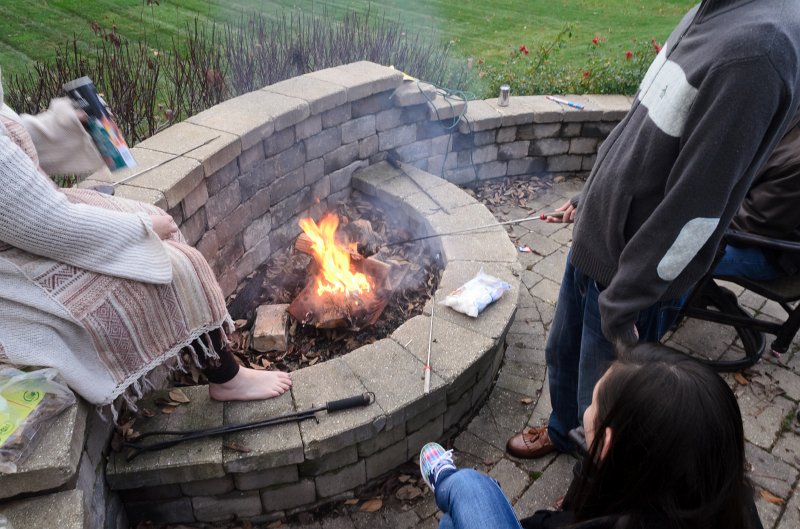 ThanksgivingNov2011-7342.jpg - Emily, Mike and Liz roasting marshmallows