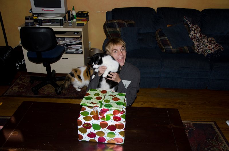 XmasDec11-7534.jpg - Mike, home from school, opens early Christmas present -- Xbox!!