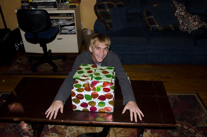 XmasDec11-7533.jpg - Mike, home from school, opens early Christmas present -- Xbox!!