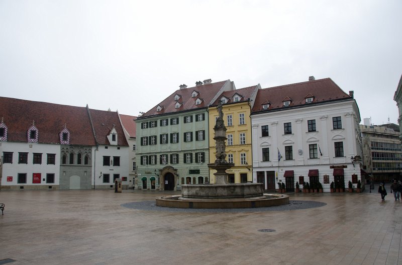 Bratislava012212-8283.jpg - Maximilian Fountain, Jeszenák Palace (white), Japan Embassy (green). Main Square / Hlavné námestie