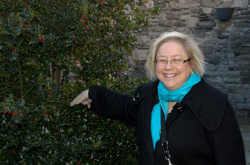 Dublin010212-7849.jpg - Cathie, pointing at Holly in gardens of Dublin Castle