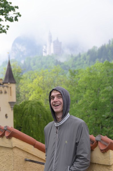 Neuschwanstein051312-0922.jpg - Mike on the grounds of  Schloss Hohenschangau Castle. Neuschwanstein castle, background