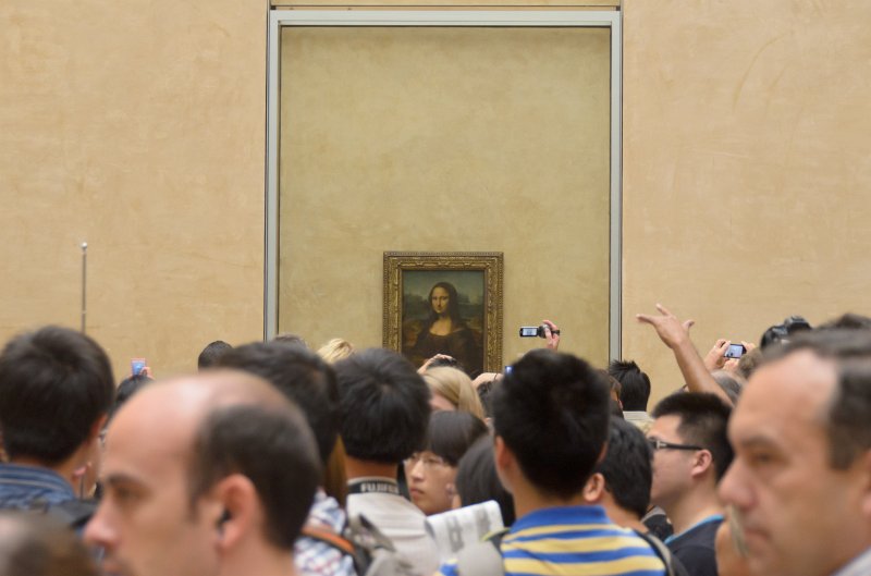 Paris062512-2797.jpg - Mona Lisa room. First floor, Denon wing.  Note the crowds are 15 people deep, in all directions, to see the Rock Star painting.