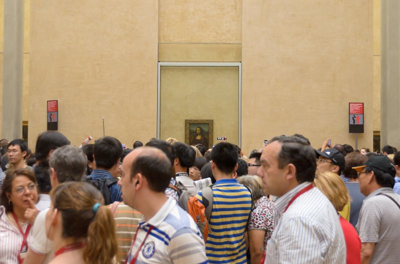 Paris062512-2798.jpg - Mona Lisa room. First floor, Denon wing.  Note the crowds are 15 people deep, in all directions, to see the Rock Star painting.