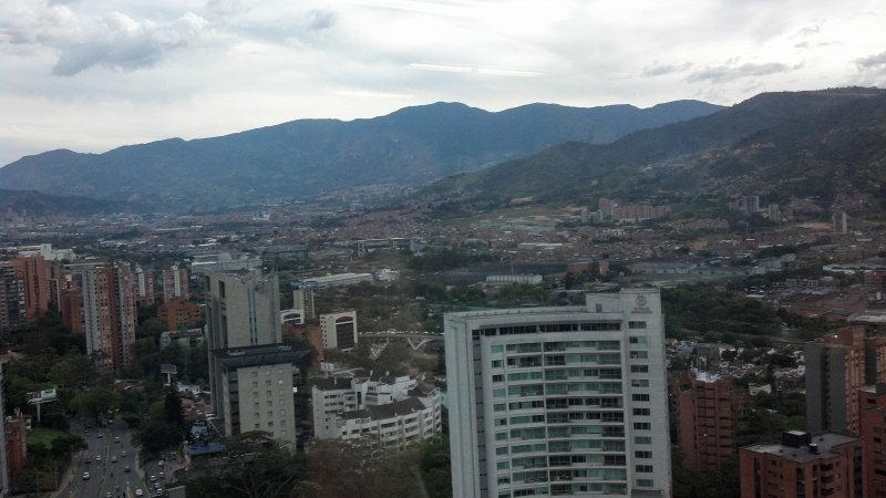 2012-07-27_17-55-31_183.jpg - Late afternoon view of Medellin, from the Forum Skyscraper, 23rd floor