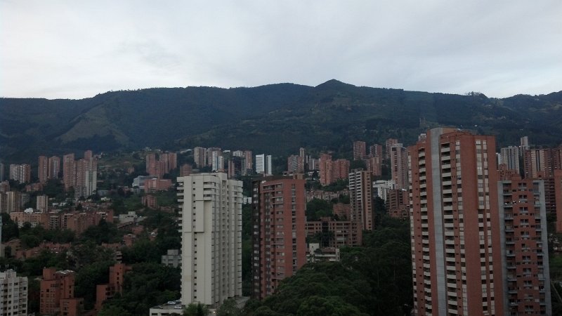 2012-07-27_19-02-49_928.jpg - Late afternoon view of Medellin, from the Forum Skyscraper, 23rd floor