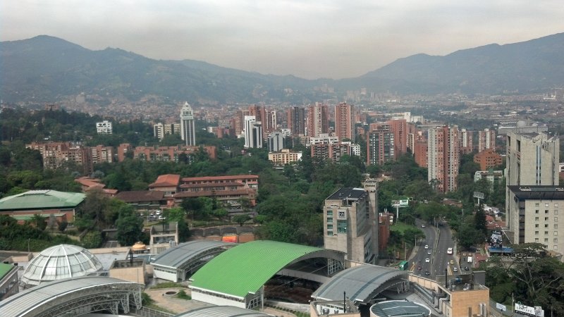 2012-07-27_10-45-21_931.jpg - Santefe Shopping Mall (foreground). View of Medellin, from the Forum Skyscraper, 23rd floor