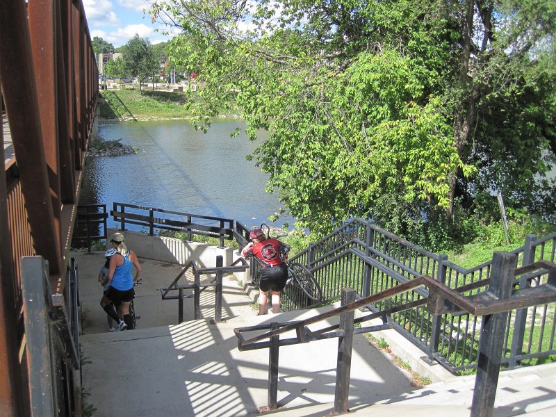 FoxRiverBike090912-4066.jpg - Walking bikes down the stairs under The Peace Bridge, crossing the Fox River just North of Wilson sreet in Batavia