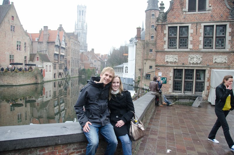 Bruges010413-4977.jpg - Mike and Liane at the iconic Rozenhoedkaai / Rose Hat Quay, at Groenerei (Green Canal) and Dijver canals. Belfort (background)