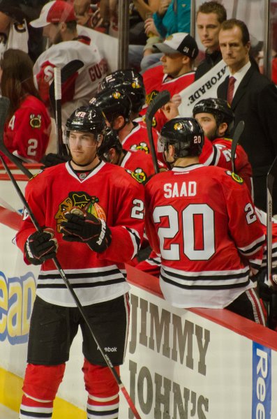 BlackHawks091713-8598.jpg - 22-Jimmy Hayes and 20-Brandon Saad at the Hawks bench.  Blackhawks vs Detroit preseason game