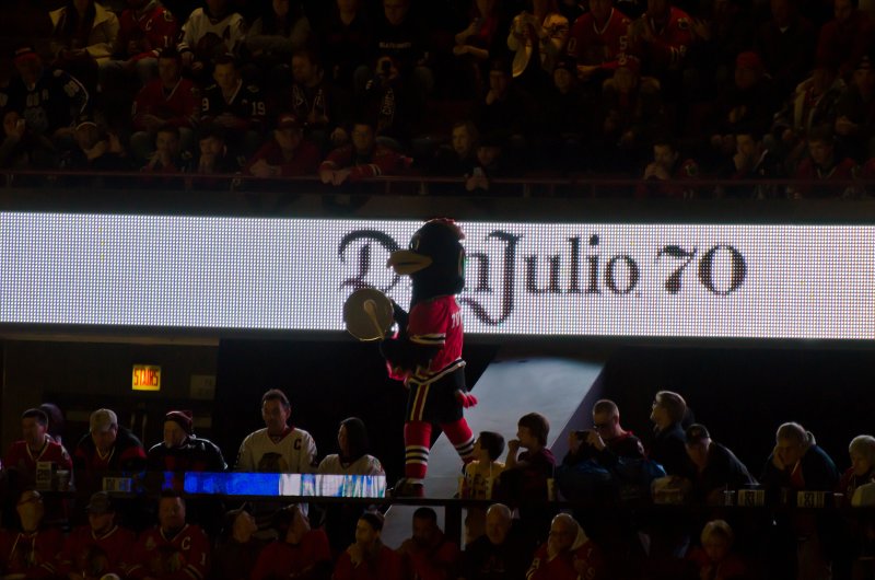 Blackhawks121513-9758.jpg - Tommy Hawk leading a cheer. Kings vs Blackhawks hockey, United Center, Chicago