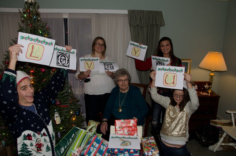 ChristmasEve122413-9893.jpg - Grandma and Mike, Liz, Emily and Mary saying "Love you" to Grandpa