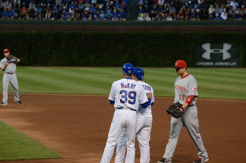 CubsVsReds081313-8052.jpg - #30 Dioner Navarro on first.  Reds: #19 Joey Votto, 1B and #2 Zack Cozart SS. Cubs vs Reds at Wrigley FIeld