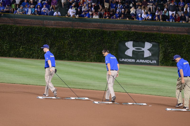 CubsVsReds081313-8109.jpg - Groud Crew doing infield grooming. Cubs vs Reds at Wrigley FIeld