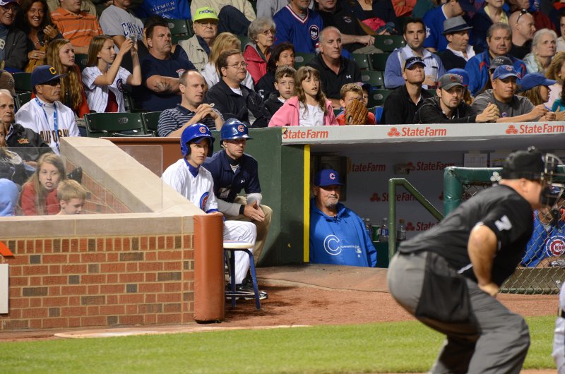CubsVsReds081313-8112.jpg - Cubs batboy and Chris Bosio, pitching coach. Cubs vs Reds at Wrigley FIeld