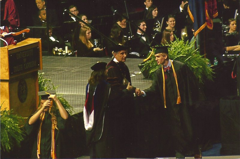 scan0002.jpg - Mike gets his diploma!  picture from Mary Turner