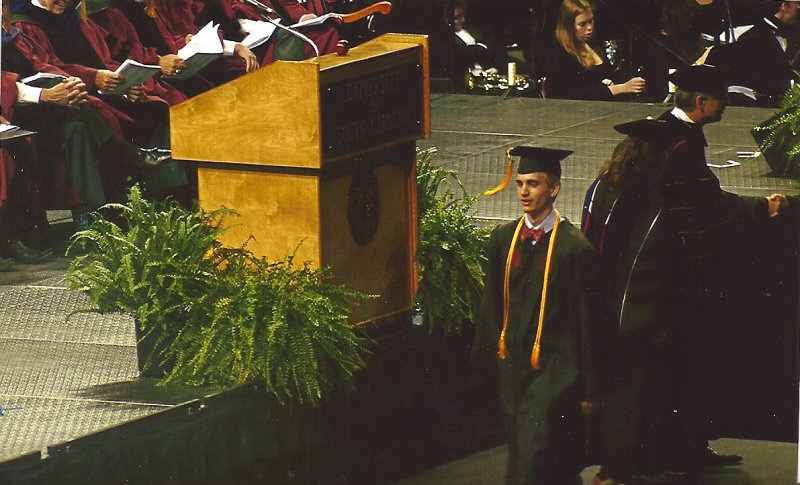 scan0003.jpg - Mike gets his diploma!  picture from Mary Turner