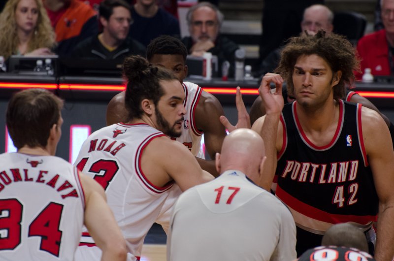 BullsVsPortland032814-0792-3.jpg - Noah and Lopez for game tip off. Bulls vs Portland Trailblazers, United Center 3/28/14