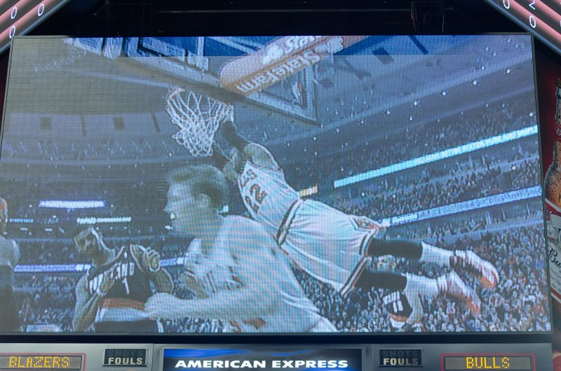 BullsVsPortland032814-0821-3.jpg - Replay of Taj Gibson's big dunk. Bulls vs Portland Trailblazers, United Center 3/28/14