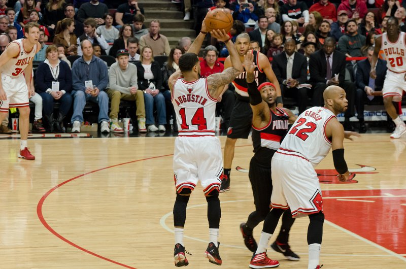 BullsVsPortland032814-0829-3.jpg - D.J. Augustin and Taj Gibson. Bulls vs Portland Trailblazers, United Center 3/28/14