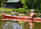 Cathie  Cathie paddling by a house near Millington. Kayaking the Fox River from Yorkville to Millington : 2014, Fox River, Kayaking, Millington, Yorkville