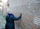 Cathie  Cathie looking at brick patterns. Walking through the Ostia Antica archeological site : 2014, Italy, Ostia Antica, Rome, archeological site